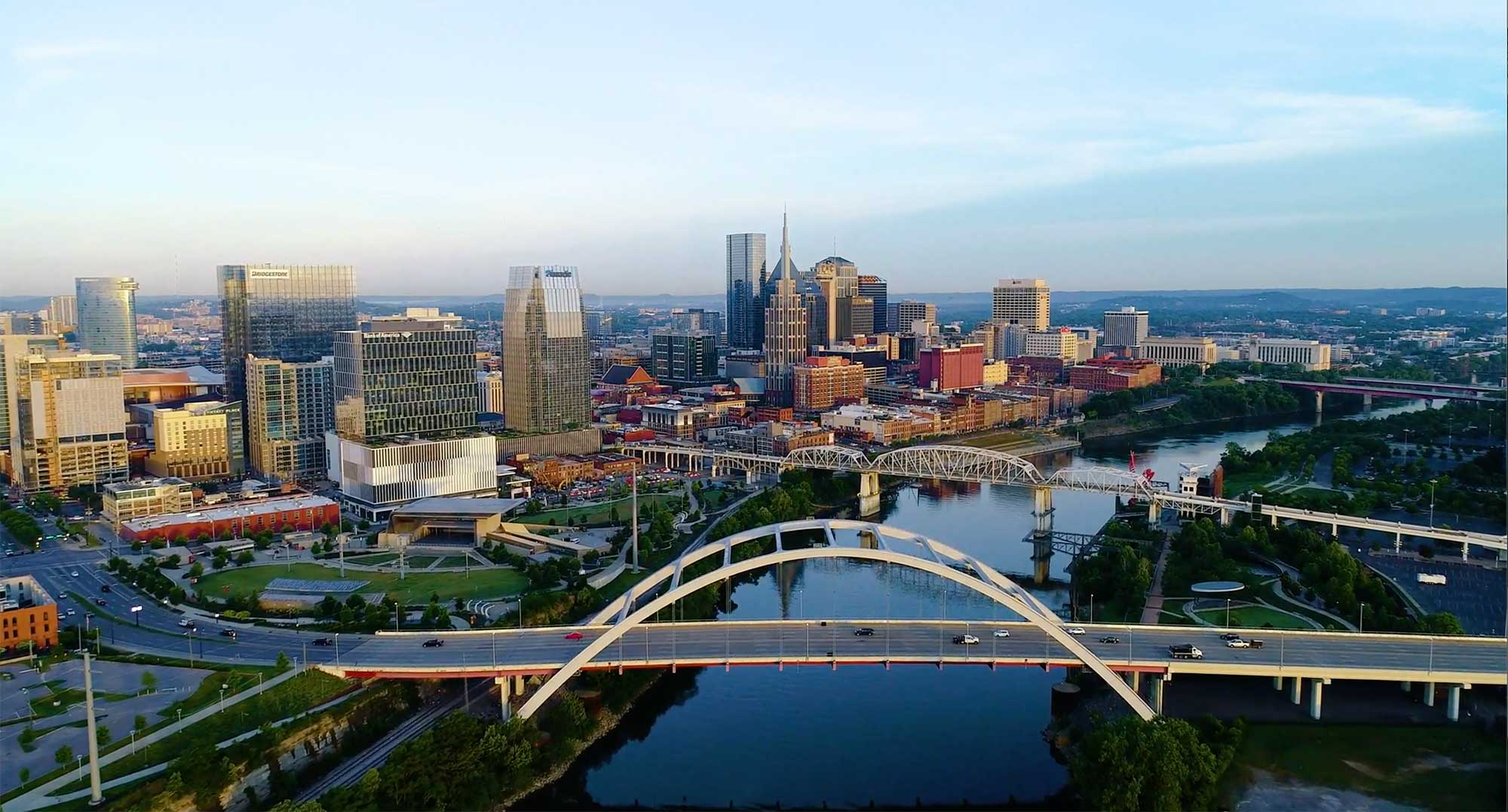 Drone photo of Nashville skyline and Cumberland River flyover.
